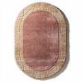 Oval area rug with textured pattern in pink and beige 100 x 60 x 2cm