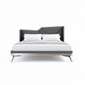 Modern upholstered queen size bed with geometric headboard design and metal legs